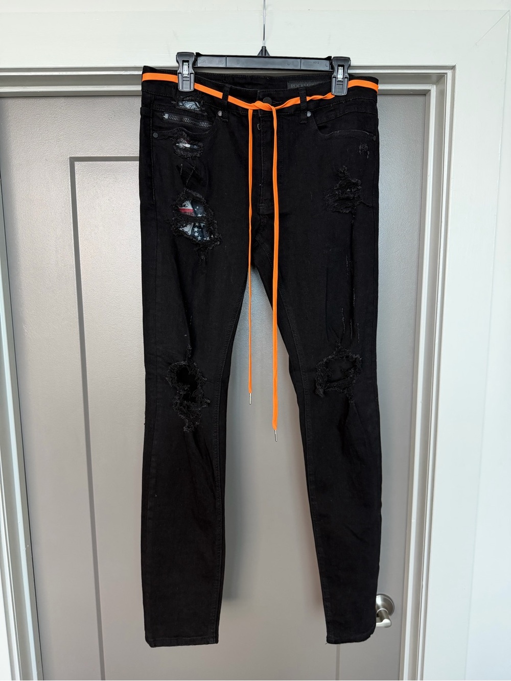 Black Skinny Distressed Jeans with Orange Accent